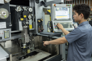 CNC machine display operating in industrial factory environment