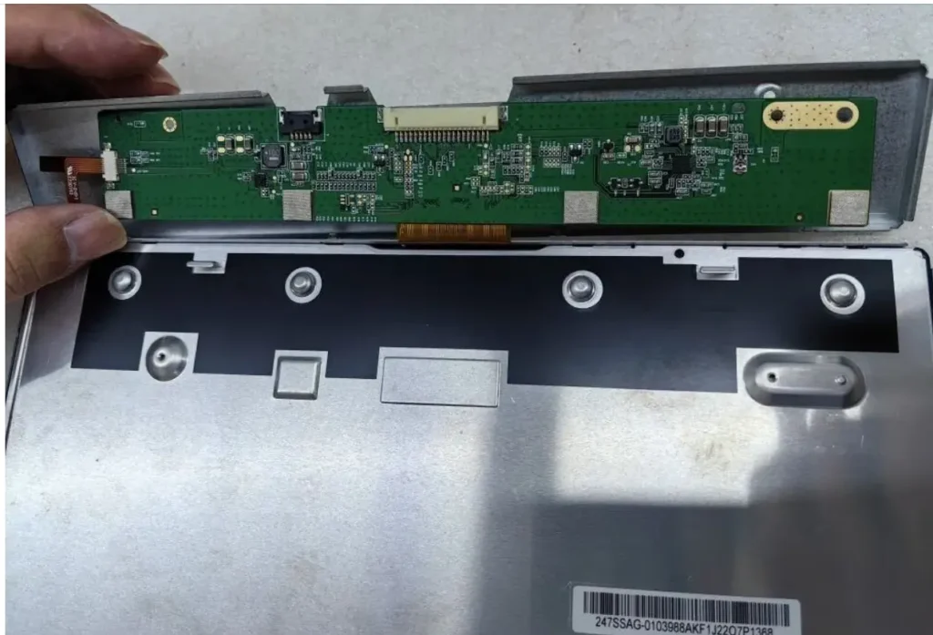 Real LCD panel T-CON board mounted along the rear edge of the LCD module